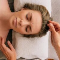 woman receiving an acupuncture treatment